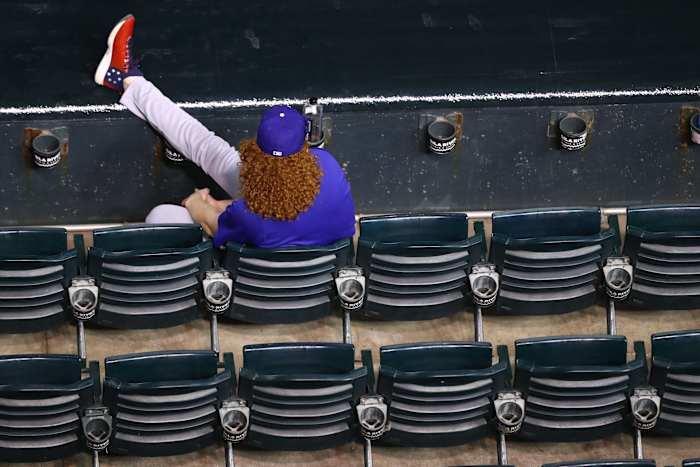 Jul 31, 2020; Phoenix, Arizona, USA; Los Angeles Dodgers pitcher Dustin May watches from the front row seats in the grandstands in the fourth inning against the Arizona Diamondbacks at Chase Field. Mandatory Credit: Mark J. Rebilas-USA TODAY Sports
